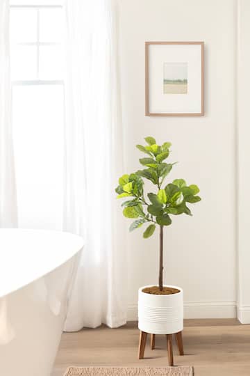 Kate and Laurel 4ft. Fidmont Faux Fiddle Fig Tree with Gavri Planter